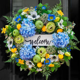 NaturaWre 24-inch wreath with blue hydrangea for a bright, welcoming front entrance.