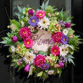 NaturaWre spring front door wreath featuring hydrangea, peony, and tulip for a welcoming entry