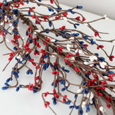 NeoL'artes 60in Patriotic Pip Berry Garland draped on a mantel for festive Americana charm.