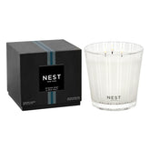 Nest New York 3-wick candle ocean mist sea salt jar for soothing seaside ambiance.