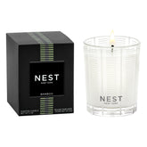 NEST New York Bamboo votive in frosted glass vessel enhances ambience.