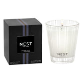 Nest New York cedar-leaf-lavender candle in glass vessel for serene ambience.
