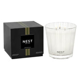 Nest New York Grapefruit 3-Wick Candle in glass container creating elegant room ambiance