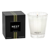 Nest New York Grapefruit Classic Candle in glass vessel enhances ambiance.
