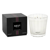Nest New York Moroccan Amber 3-Wick Candle in a frosted striped glass jar for elegant decor.