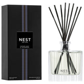 Nest New York Reed Diffuser cedar leaf lavender bottle releasing a calming fragrance in your space