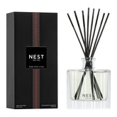NEST New York Rose Noir & Oud diffuser bottle releasing continuous fragrance in an elegant space