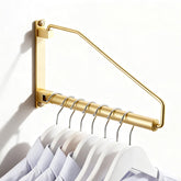 NEWRAIN folding wall-mounted clothes hanger rack in brushed gold offers ample hanging space.