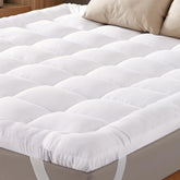 Niagara Sleep Solution Ultra Soft King Topper on bed for plush comfort and back support.