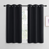 NICETOWN blackout curtains two-panel set with silver grommets for easy sliding and privacy.
