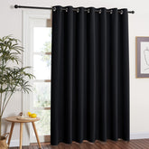 NICETOWN blackout sliding door curtain with wide coverage blocks sunlight and glare.