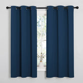 NICETOWN Moroccan blue blackout curtains block light for a calmer bedroom.