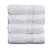 NY Loft four-piece white bath towel set with soft plush texture.