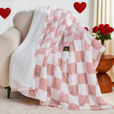 OCTROT light pink heated blanket with soft sherpa for cozy lounging warmth.