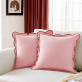 Ohocut scalloped-edge pillow cover in blush pink on a couch, adding elegant texture