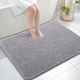 OLANLY bath rug with soft chenille pile for cozy feet after showers.