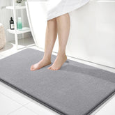 OLANLY thick memory foam bath mat in gray offers cloud-like comfort by the tub.