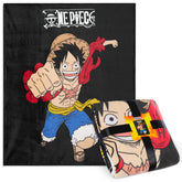 One Piece fleece throw blanket on a couch adds cozy anime style for relaxed evenings.