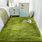 Ophanie Green Grass area rug with a soft shag surface for cozy bedroom floors.