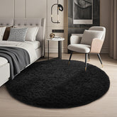 Ophanie round rug 4ft black in a cozy living space with plush, non-slip comfort.