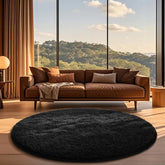 Ophanie round rug 6ft black with fluffy texture adds cozy living room style.