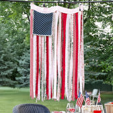 ORIENTAL CHERRY rag American flag banner displayed on porch walls adds rustic patriotic charm.