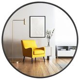Oruii round mirror 24 inch on wall with crystal-clear reflection.