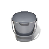 OXO Good Grips compost bin with charcoal lid open for easy one-handed filling.