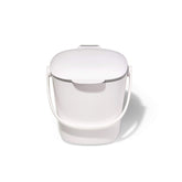 OXO Good Grips compost bin with lid open for quick disposal on the counter.