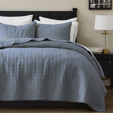 Palassio Blue Grey quilt on a bed offers breathable all-season comfort.