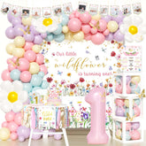 Party Inspo Wildflower backdrop for a soft first birthday photo moment