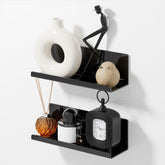 PAVSTINE acrylic floating shelf in black for wall display and clutter-free storage.