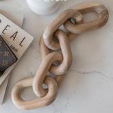 Peakoly acacia chain link decor on coffee table adds modern warmth to living room