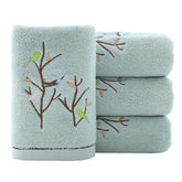Pidada Bird Tree embroidery towels add decorative flair to your bathroom.