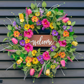 Pinkpuii Spring Wreath on front door with tulips and eucalyptus for curb appeal.