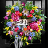 Pinkpuii Spring Wreath close-up blooms add vibrant front door appeal.