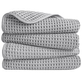 POLYTE microfiber hand towel folded to show waffle weave for quick, lint-free drying.