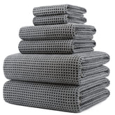 POLYTE bath towel 30x60 inches in waffle weave for quick drying and plush feel.