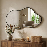 Potijo irregular wall mirror 20x36 with black frame provides clear reflection and modern style.