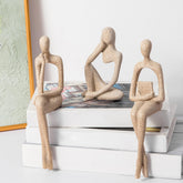 Prettidecor gold thinker statue on shelf for modern elegance