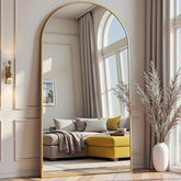 Prywot arched full-length mirror on stand in gold brightens a room and checks outfits.