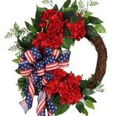 Pudate patriotic wreath with hydrangeas and ivy for a welcoming front door.