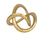 PUHOZN geometric gold knot sculpture on shelf adds contemporary elegance.