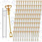 PullCrease bubble wand with gold double-heart design for weddings and celebrations.