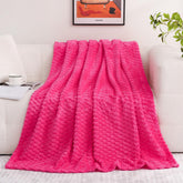 Puncuntex hot pink throw blanket close-up shows plush fleece texture and rich color.