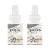 Pura Barr-Co. original scent bottle pour enhances living room ambiance.