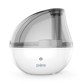 Pure Enrichment MistAire Silver humidifier on a table delivering subtle moisture for a comfortable room.