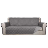 PureFit reversible quilted sofa cover in gray front view offers versatile styling and protection.