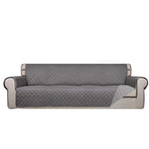 PureFit reversible quilted sofa cover in gray, dual colors for versatile styling.