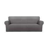 PureFit Super Stretch slipcover in light gray fits many sofas and protects against wear.